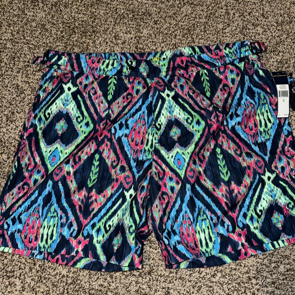 Men’s swim trunks NWT never worn.  Comes with matching travel bag - Picture 1 of 3